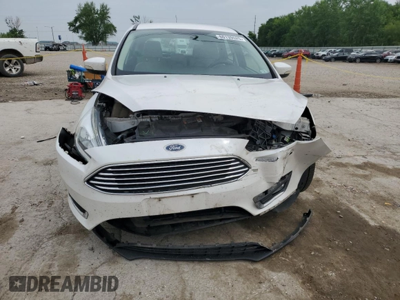 2016 Ford Focus Titanium z VIN 1FADP3N23GL345904, wystawiony jako Copart lot #60139525 z przebiegiem 97 572 mil mil oraz Szkoda całkowita • Salvage title. Historia ofert i sprzedaży dostępna na DreamBid. Obrazek 5.