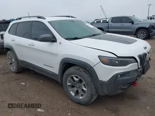 2019 Jeep Cherokee Trailhawk Elite z VIN 1C4PJMBX1KD476881, wystawiony jako IAAI lot #41922450 z przebiegiem 75 248 mil mil oraz . Historia ofert i sprzedaży dostępna na DreamBid. Obrazek 1.