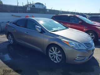 2013 Hyundai Azera with VIN KMHFH4JG2DA256481, listed as a IAAI auction lot 41673405 with 180,130 mi miles. Bid and sale history available at carsss.com. Image 1.