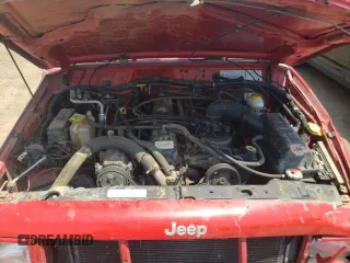 1999 Jeep Cherokee Sport z VIN 1J4FF68SXXL662401, wystawiony jako Copart lot #59698565 z przebiegiem Nie podano mil oraz Szkoda całkowita • Salvage title. Historia ofert i sprzedaży dostępna na DreamBid. Obrazek 11.