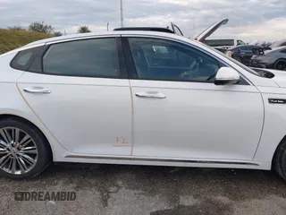2018 Kia Optima SX z VIN 5XXGV4L21JG182103, wystawiony jako IAAI lot #40522762 z przebiegiem 60 542 mil mil oraz . Historia ofert i sprzedaży dostępna na DreamBid. Obrazek 13.