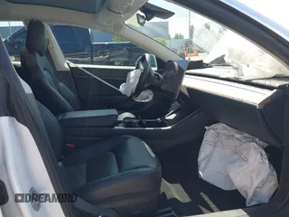 2020 Tesla Model 3 Standard Range Plus with VIN 5YJ3E1EAXLF590591, listed as a IAAI auction lot 42140338 with 79,342 mi miles and . Bid and sale history available at DreamBid. Image 5.