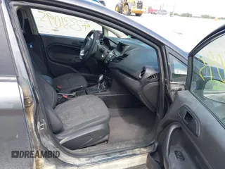 2017 Ford Fiesta SE z VIN 3FADP4BJ2HM134825, wystawiony jako IAAI lot #42331095 z przebiegiem 117 794 mil mil oraz . Historia ofert i sprzedaży dostępna na DreamBid. Obrazek 5.