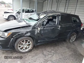 2015 Dodge Journey R/T with VIN 3C4PDDEG3FT555035, listed as a IAAI auction lot 41067936 with 214,244 mi miles and . Bid and sale history available at DreamBid. Image 14.