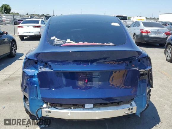 2024 Tesla Model Y z VIN 7SAYGDED9RF005104, wystawiony jako Copart lot #64974545 z przebiegiem 20 422 mil mil oraz Szkoda całkowita • Salvage title. Historia ofert i sprzedaży dostępna na DreamBid. Obrazek 6.