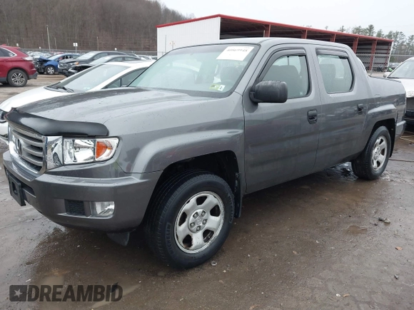 2012 Honda Ridgeline RT with VIN 5FPYK1F24CB456298, listed as a IAAI auction lot 40869948 with 123,329 mi miles and . Bid and sale history available at DreamBid. Image 2.