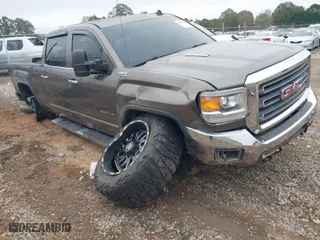 2015 GMC Sierra 2500HD SLT with VIN 1GT12ZE85FF114311, listed as a IAAI auction lot 40816192 with 155,844 mi miles. Bid and sale history available at carsss.com. Image 1.