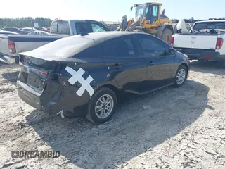 2021 Toyota Prius L Eco z VIN JTDKAMFU6M3141392, wystawiony jako IAAI lot #42317866 z przebiegiem 137 495 mil mil oraz . Historia ofert i sprzedaży dostępna na DreamBid. Obrazek 4.