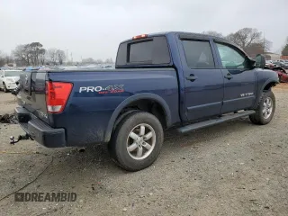 2011 Nissan Titan Pro-4X z VIN 1N6BA0EC0BN322228, wystawiony jako Copart lot #47617305 z przebiegiem 189 151 mil mil oraz Szkoda całkowita • Salvage title. Historia ofert i sprzedaży dostępna na DreamBid. Obrazek 3.