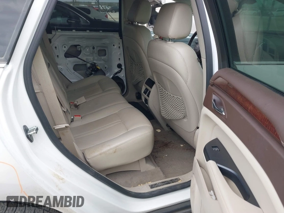2015 Cadillac SRX Luxury Collection z VIN 3GYFNBE31FS552323, wystawiony jako IAAI lot #41553081 z przebiegiem 91 214 mil mil oraz . Historia ofert i sprzedaży dostępna na DreamBid. Obrazek 8.