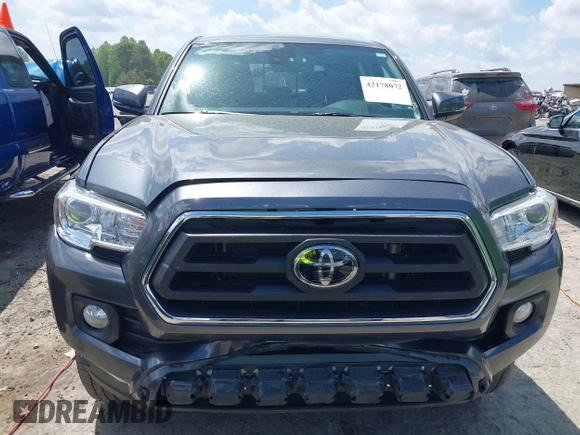 2021 Toyota Tacoma SR z VIN 3TMCZ5AN2MM392590, wystawiony jako IAAI lot #42178072 z przebiegiem 42 542 mil mil oraz . Historia ofert i sprzedaży dostępna na DreamBid. Obrazek 12.