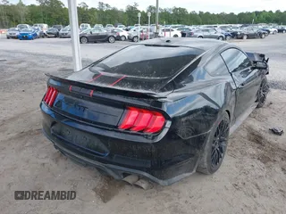 2018 Ford Mustang GT z VIN 1FA6P8CF0J5184418, wystawiony jako IAAI lot #42037264 z przebiegiem 99 679 mil mil oraz . Historia ofert i sprzedaży dostępna na DreamBid. Obrazek 4.