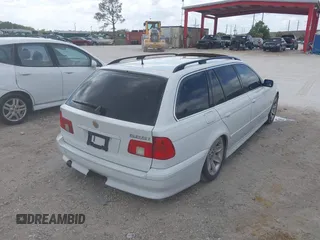 2002 BMW 5 Series 525iAT with VIN WBADS43482GD86937, listed as a IAAI auction lot 41940547 with 196,458 mi miles. Bid and sale history available at carsss.com. Image 4.