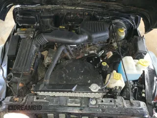 1998 Jeep Wrangler SE with VIN 1J4FY29P2WP711675, listed as a Copart auction lot 50790335 with 163,928 mi miles and Salvage Title. Bid and sale history available at carsss.com. Image 11.
