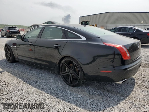 2014 Jaguar XJ with VIN SAJWA2GZ7E8V60213, listed as a Copart auction lot 53382454 with 88,870 mi miles and Salvage Title. Bid and sale history available at carsss.com. Image 2.