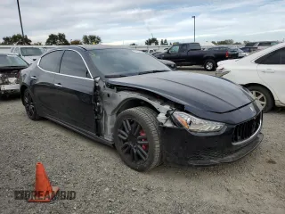 2015 Maserati Ghibli with VIN ZAM57XSA5F1149616, listed as a Copart auction lot 71738433 with 82,300 mi miles. Bid and sale history available at carsss.com. Image 4.