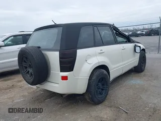2006 Suzuki Grand Vitara z VIN JS3TE941064100737, wystawiony jako IAAI lot #41598940 z przebiegiem Nie podano mil oraz . Historia ofert i sprzedaży dostępna na DreamBid. Obrazek 4.