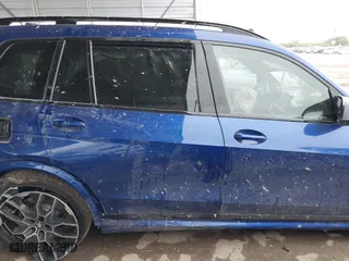 2025 BMW X7 M60i with VIN 5UX33EM0XS9X98693, listed as a IAAI auction lot 41009705 with 2,814 mi miles. Bid and sale history available at carsss.com. Image 13.