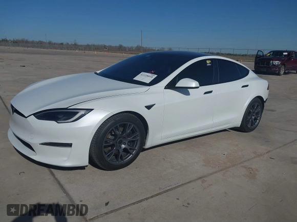 2022 Tesla Model S Plaid with VIN 5YJSA1E69NF486471, listed as a IAAI auction lot 41228818 with 49,207 mi miles and . Bid and sale history available at carsss.com. Image 2.