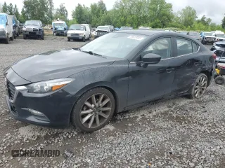 2017 Mazda 3 Touring z VIN JM1BN1V7XH1143503, wystawiony jako Copart lot #58628085 z przebiegiem 181 345 mil mil oraz Szkoda całkowita • Salvage title. Historia ofert i sprzedaży dostępna na DreamBid. Obrazek 1.