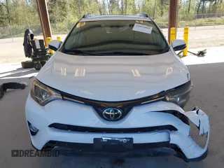 2018 Toyota RAV4 XLE with VIN JTMRFREVXJD240388, listed as a IAAI auction lot 42052065 with 117,114 mi miles. Bid and sale history available at carsss.com. Image 13.