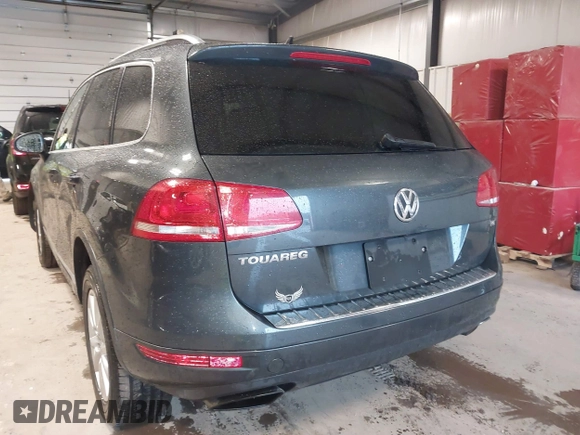 2013 Volkswagen Touareg Lux with VIN WVGEF9BP6DD007032, listed as a IAAI auction lot 41684721 with 147,249 mi miles and . Bid and sale history available at DreamBid. Image 3.