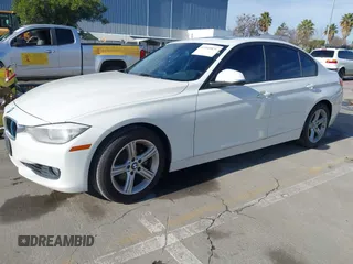 2015 BMW 3 Series 328i with VIN WBA3C1C52FK119339, listed as a IAAI auction lot 41549876 with 148,347 mi miles and . Bid and sale history available at carsss.com. Image 2.