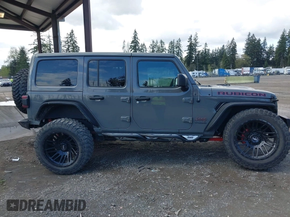 2021 Jeep Wrangler Unlimited Rubicon with VIN 1C4HJXFG9MW531858, listed as a IAAI auction lot 42001095 with 38,240 mi miles and . Bid and sale history available at DreamBid. Image 13.
