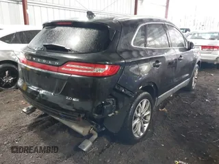 2015 Lincoln MKC with VIN 5LMCJ2A98FUJ17855, listed as a IAAI auction lot 41433416 with 113,070 mi miles. Bid and sale history available at carsss.com. Image 4.