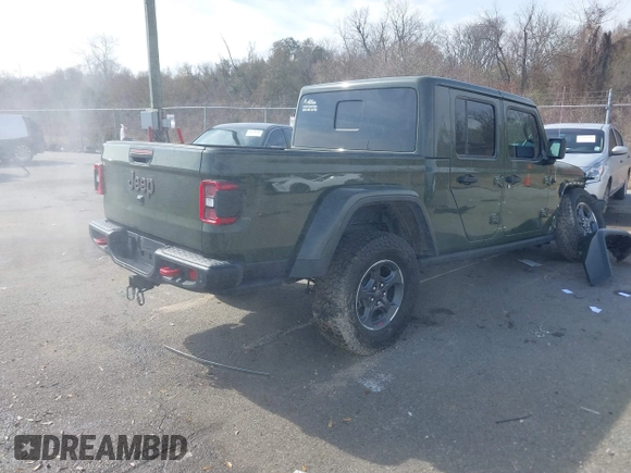 2023 Jeep Gladiator Rubicon with VIN 1C6JJTBGXPL586154, listed as a IAAI auction lot 41370352 with 11,207 mi miles and . Bid and sale history available at DreamBid. Image 4.