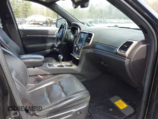 2014 Jeep Grand Cherokee Limited with VIN 1C4RJFBG9EC258590, listed as a IAAI auction lot 42178333 with 125,861 mi miles and . Bid and sale history available at DreamBid. Image 5.