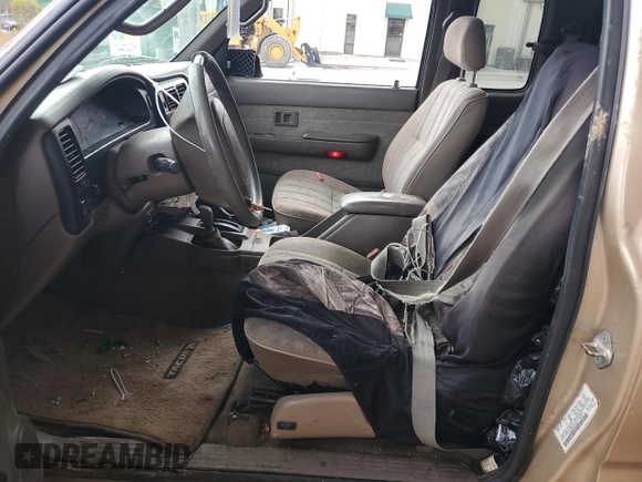 1999 Toyota Tacoma with VIN 4TAWN72NXXZ563507, listed as a Copart auction lot 49888575 with 387,818 mi miles and Salvage title. Bid and sale history available at DreamBid. Image 7.