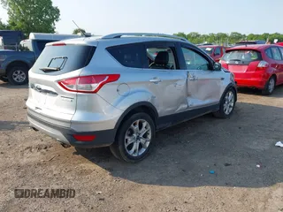 2015 Ford Escape Titanium z VIN 1FMCU0J90FUC02039, wystawiony jako IAAI lot #42369882 z przebiegiem 156 287 mil mil oraz . Historia ofert i sprzedaży dostępna na DreamBid. Obrazek 4.