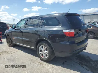 2013 Dodge Durango SXT with VIN 1C4RDJAG3DC575923, listed as a Copart auction lot 60100195 with 211,606 mi miles and Salvage title. Bid and sale history available at DreamBid. Image 2.