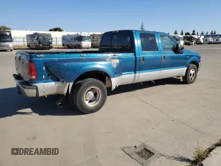 2000 Ford F-350 with VIN 1FTWW32S9YED99031, listed as a Copart auction lot 75952254 with 220,673 mi miles and Salvage title. Bid and sale history available at DreamBid. Image 3.