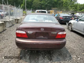 2000 Mazda 626 LX z VIN 1YVGF22C4Y5112874, wystawiony jako Copart lot #58952175 z przebiegiem 100 070 mil mil oraz Szkoda całkowita • Salvage title. Historia ofert i sprzedaży dostępna na DreamBid. Obrazek 6.