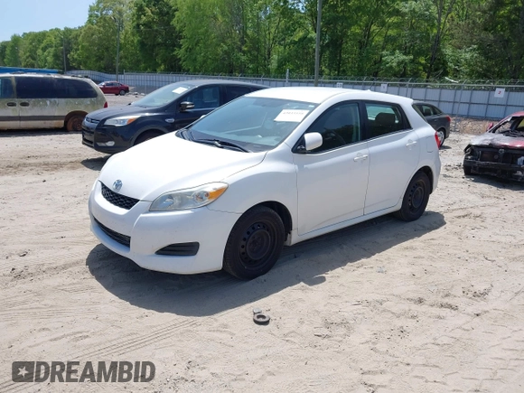 2009 Toyota Matrix with VIN 2T1KU40E39C091087, listed as a IAAI auction lot 42033558 with 338,496 mi miles. Bid and sale history available at carsss.com. Image 2.