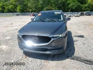 2018 Mazda CX-5 Grand Touring with VIN JM3KFADM9J0343621, listed as a Copart auction lot 52284475 with 129,776 mi miles and Salvage Title. Bid and sale history available at DreamBid. Image 12.