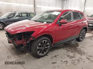 2016 Mazda CX-5 Grand Touring with VIN JM3KE4DY7G0731057, listed as a IAAI auction lot 41118072 with 134,107 mi miles and . Bid and sale history available at carsss.com. Image 18.