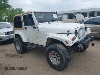 2000 Jeep Wrangler Sahara z VIN 1J4FA59S3YP740762, wystawiony jako IAAI lot #42225322 z przebiegiem 102 920 mil mil oraz . Historia ofert i sprzedaży dostępna na DreamBid. Obrazek 1.