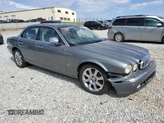 2006 Jaguar XJ with VIN SAJWA71B06SH03941, listed as a Copart auction lot 76013984 with 0 mi miles and Salvage Title. Bid and sale history available at carsss.com. Image 4.