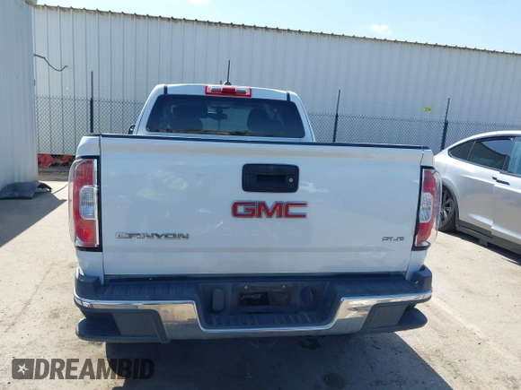 2015 GMC Canyon 2WD SLE z VIN 1GTH5BEA4F1239815, wystawiony jako IAAI lot #42135355 z przebiegiem 110 696 mil mil oraz . Historia ofert i sprzedaży dostępna na DreamBid. Obrazek 17.
