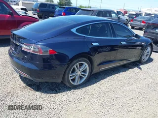2014 Tesla Model S 60 with VIN 5YJSA1H18EFP31969, listed as a IAAI auction lot 42312485 with 90,043 mi miles and . Bid and sale history available at DreamBid. Image 4.