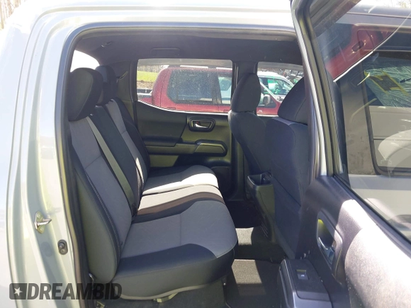 2020 Toyota Tacoma SR5 z VIN 5TFCZ5AN5LX229019, wystawiony jako IAAI lot #41907694 z przebiegiem 79 355 mil mil oraz . Historia ofert i sprzedaży dostępna na DreamBid. Obrazek 8.
