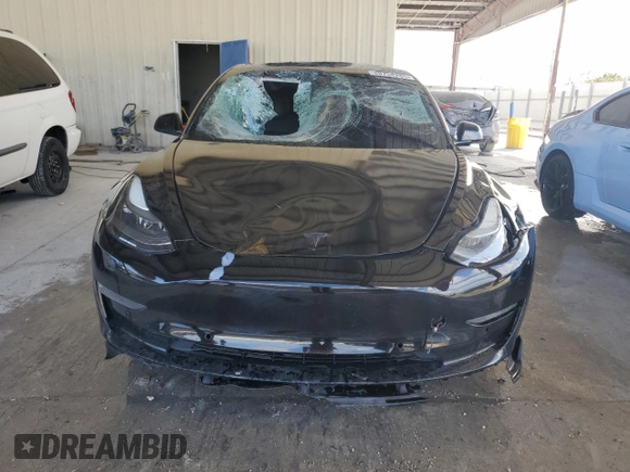 2021 Tesla Model 3 Standard Range Plus with VIN 5YJ3E1EA2MF048564, listed as a Copart auction lot 88754285 with 57,894 mi miles and Non Repairable. Bid and sale history available at DreamBid. Image 5.