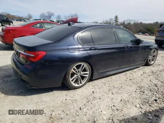 2019 BMW 7 Series 740i xDrive с VIN WBA7E4C51KGV70305, выставлен на аукционе Copart как лот 50009705 с пробегом 129 427 миль миль и Списание • Salvage title. История ставок и продаж доступна на DreamBid. Изображение 3.