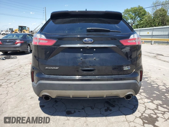 2020 Ford Edge SEL с VIN 2FMPK4J94LBA81516, выставлен на аукционе Copart как лот 56176725 с пробегом 129 952 миль миль и Списание • Salvage title. История ставок и продаж доступна на DreamBid. Изображение 6.