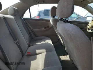 2004 Toyota Corolla CE with VIN 1NXBR32E74Z240293, listed as a Copart auction lot 52624445 with 299,999 mi miles and Salvage Title. Bid and sale history available at DreamBid. Image 10.