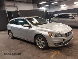 2016 Volvo V60 T5 Drive-E Premier z VIN YV140MEK9G1319298, wystawiony jako IAAI lot #42241806 z przebiegiem 108 931 mil mil oraz . Historia ofert i sprzedaży dostępna na DreamBid. Obrazek 1.