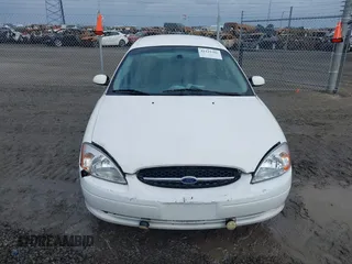 2002 Ford Taurus SES Standard with VIN 1FAFP55U12A184513, listed as a IAAI auction lot 41125306 with 241,896 mi miles. Bid and sale history available at carsss.com. Image 12.